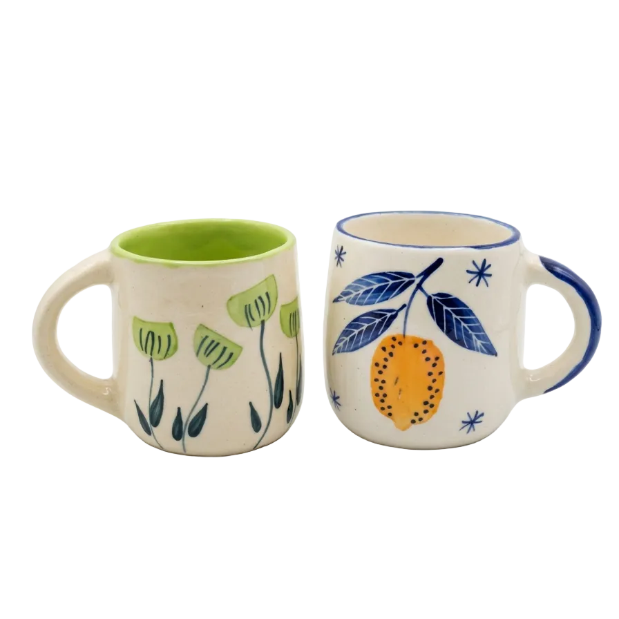 Green floral mug and lemon mug in white background