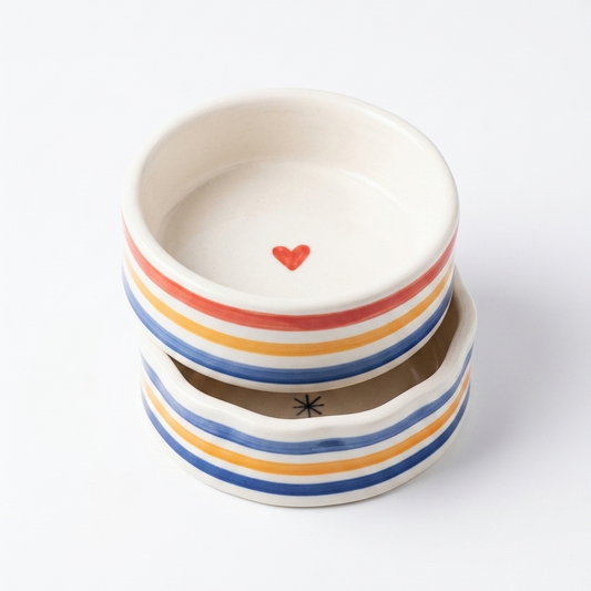 two bowls stacked on top of each other in a white background
