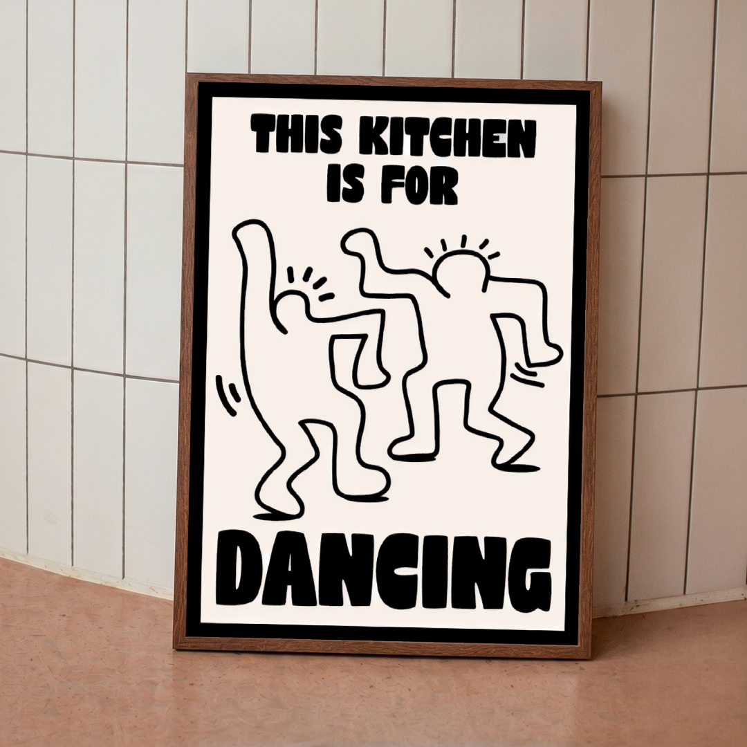 Framed poster with 'This kitchen is for dancing' text and abstract figures on a tiled wall.