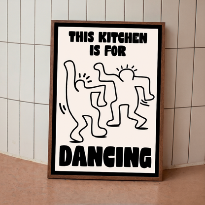 Framed poster with 'This kitchen is for dancing' text and abstract figures on a tiled wall.