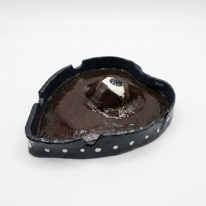Protruding eye ashtray