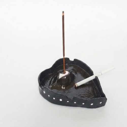 Single left side view of ashtray