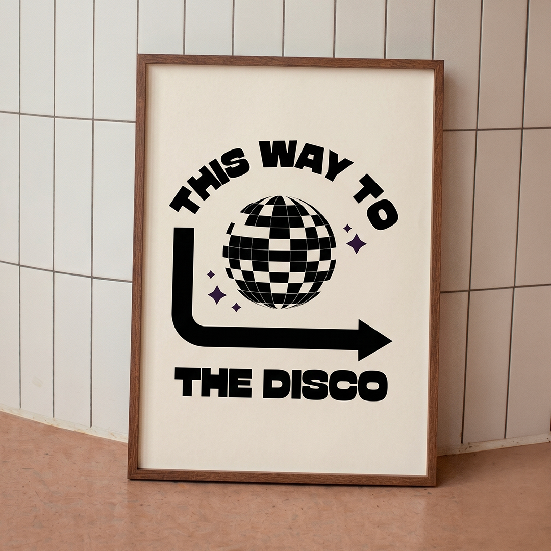 Framed poster with 'This Way To The Disco' text and disco ball graphic on a tiled wall background.