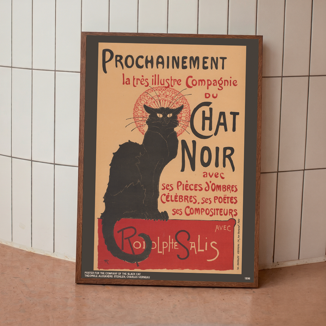 Framed poster of a black cat with text on a tiled wall background
