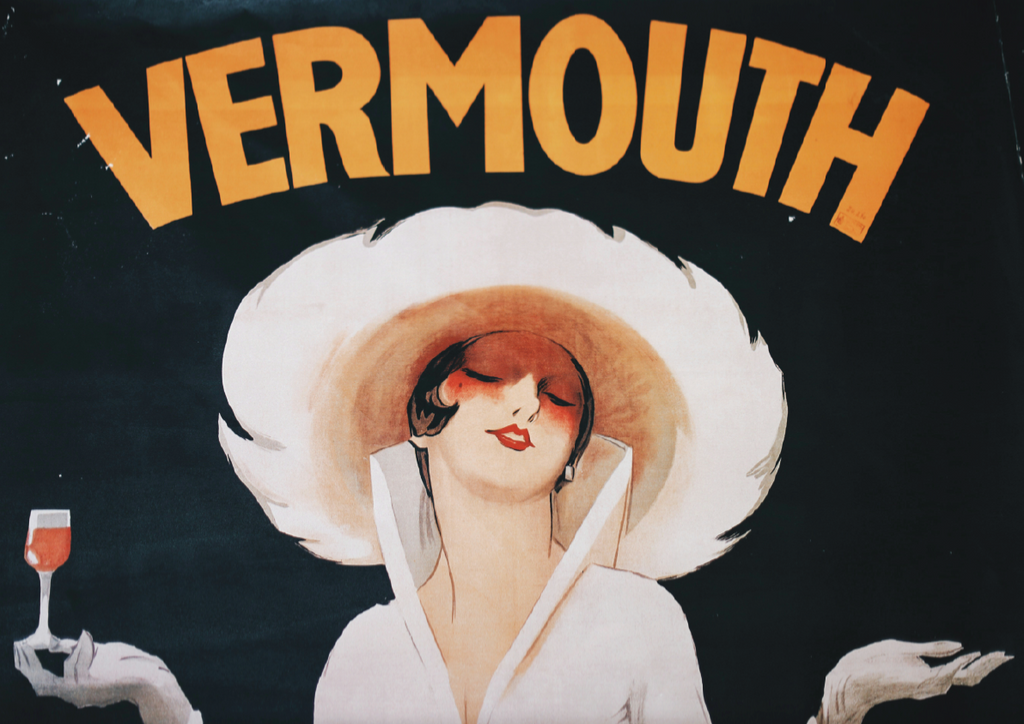 Vintage-style advertisement for vermouth with a woman in a white dress and large hat.