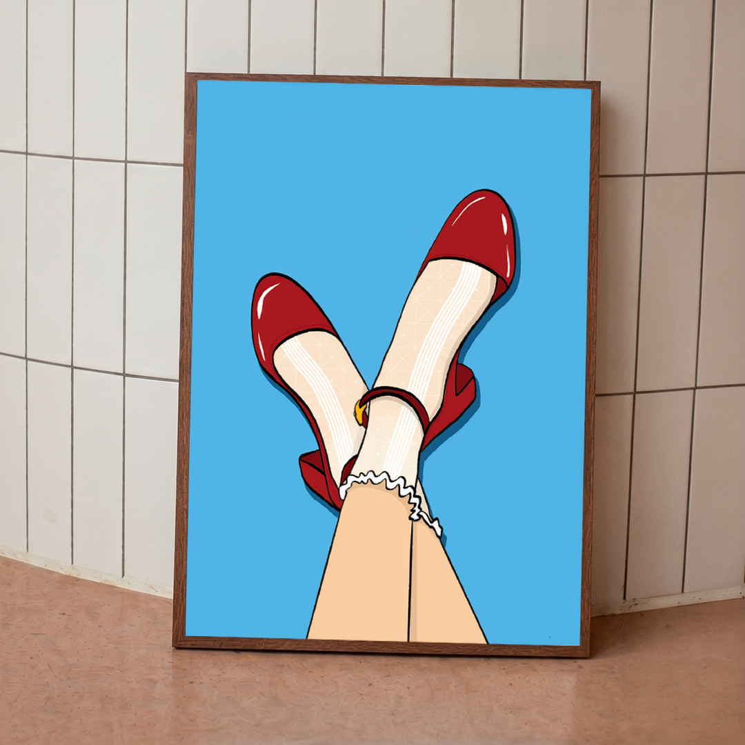 Framed artwork of legs in red shoes on a blue background, leaning against a tiled wall.