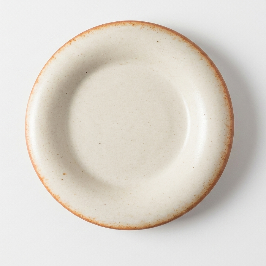 Beige ceramic plate on a white background