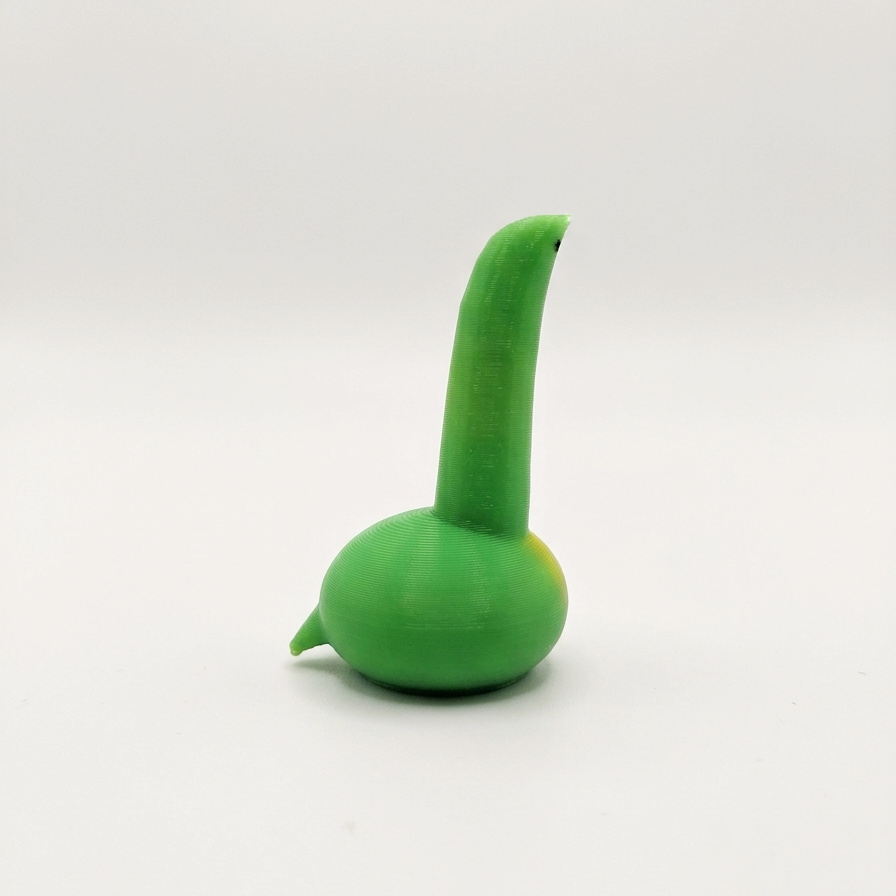 A small green3d printed dinosaur with a bulbous base and a long curved neck, photographed on a plain light gray studio background.