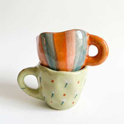 stacked orange and green handmade cups