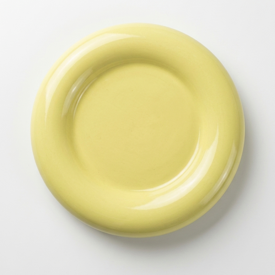 Yellow ceramic plate on a white background